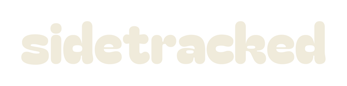 Sidetracked lowercase wordmark in cream lettering on a transparent background.